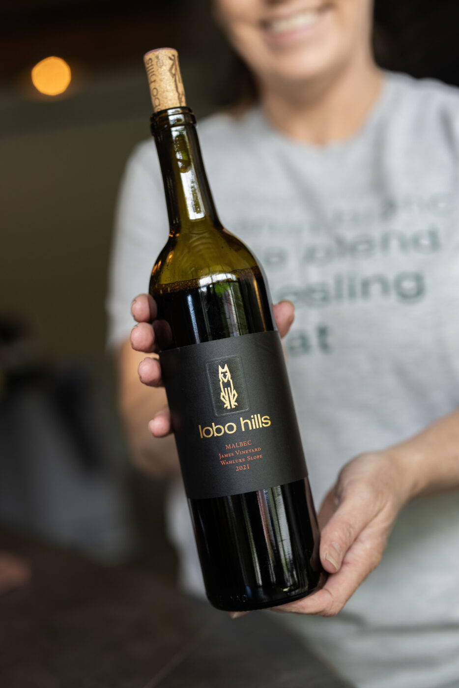 Depict image accurately for accessibility. Label of Lobo Hills Sauvignon Blanc wine bottle with description.